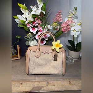 Coach Ivie Bennett Satchel in a Signature Jacquard fabric with smooth leather.